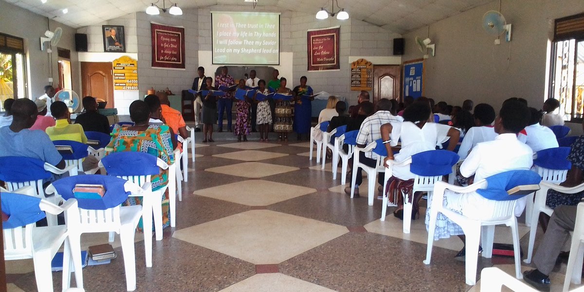 The congregation worshipping together in the sanctuary