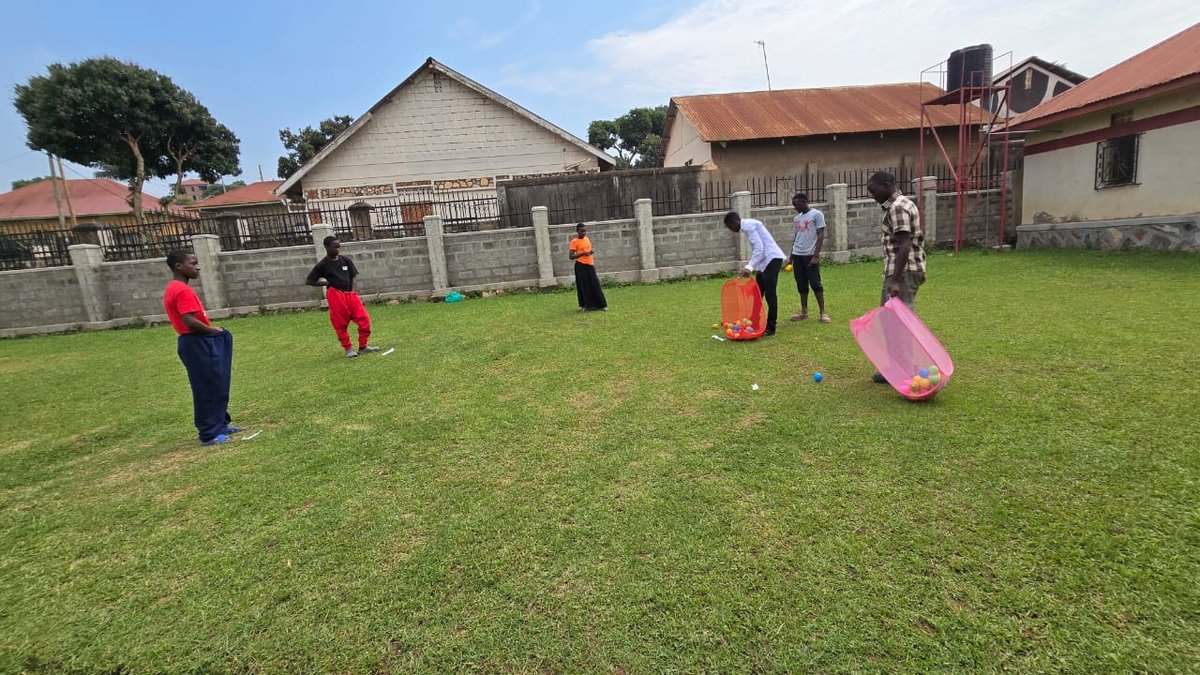 Children playing with hoops on the church lawn at 5 Day Club