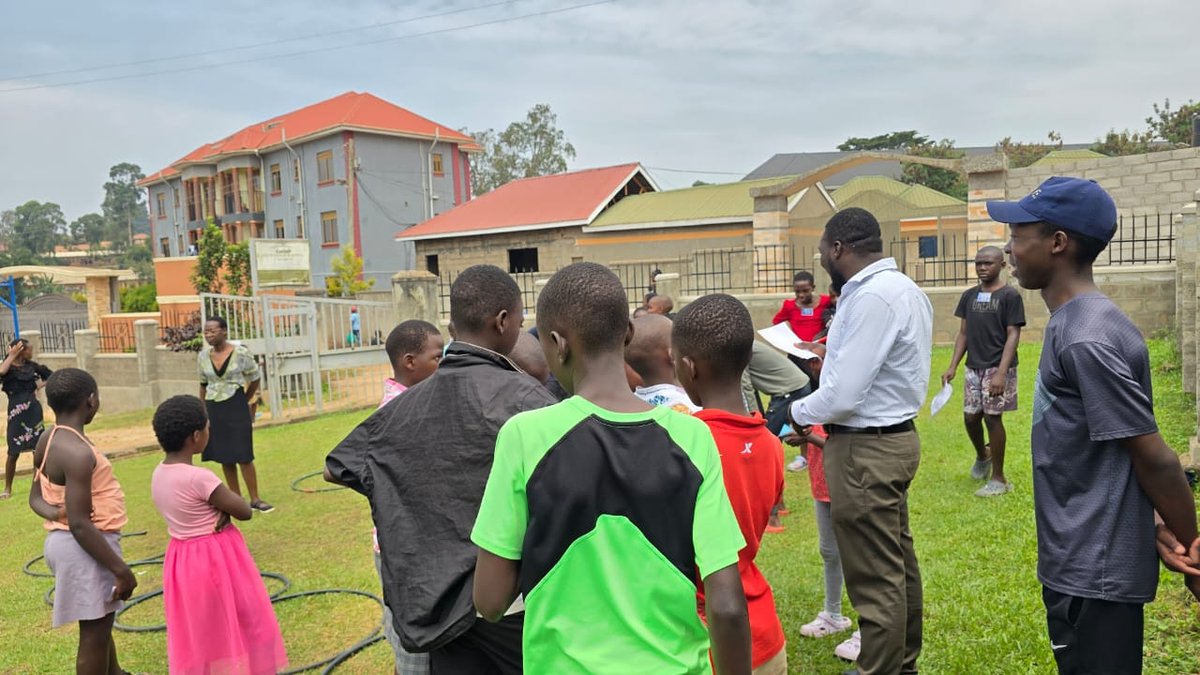 Children and leaders gathered outside for an activity at 5 Day Club