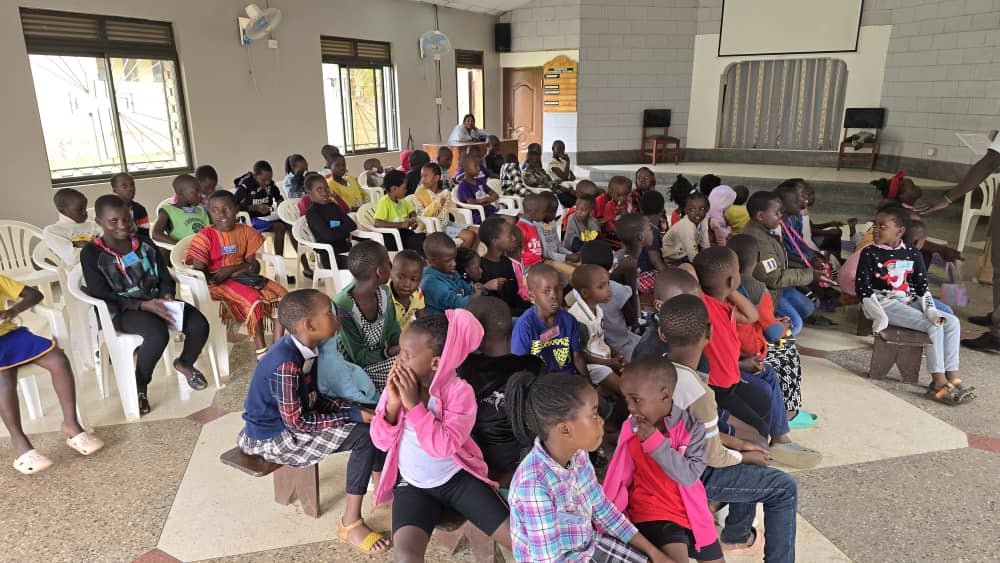 Children and leaders seated across the sanctuary at 5 Day Club