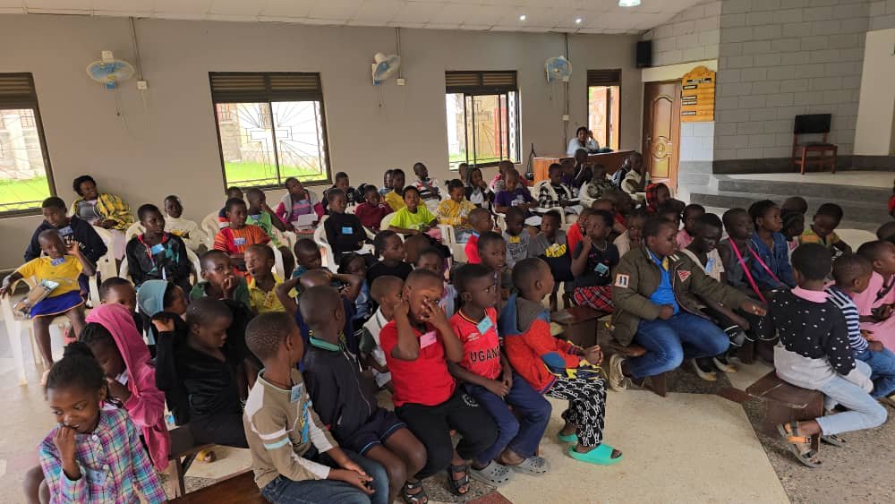 Children gathered together inside the church at 5 Day Club