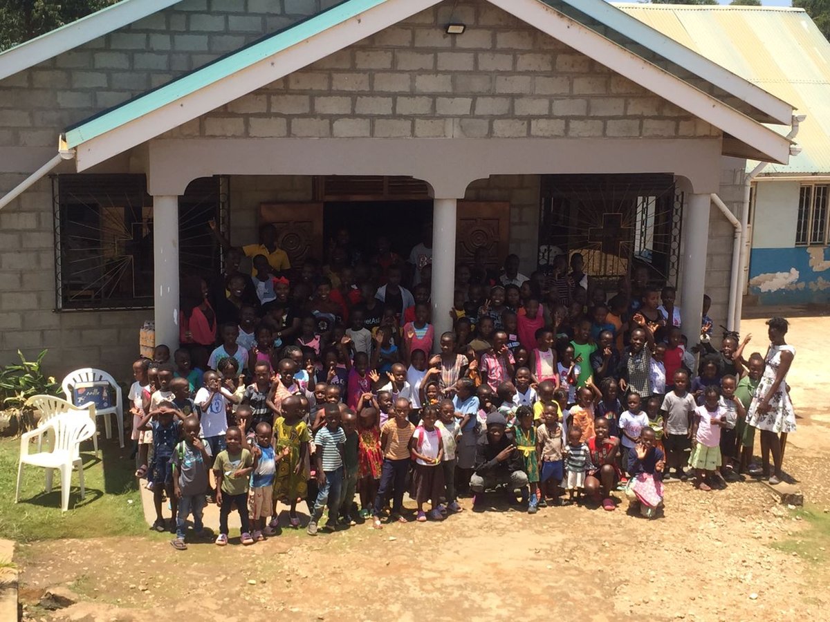 Children and leaders gathered outside the church at 5 Day Club