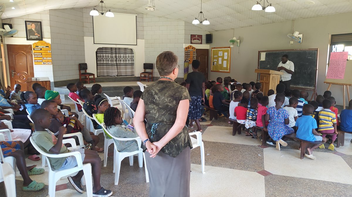 Children gathered inside the church with leaders at 5 Day Club