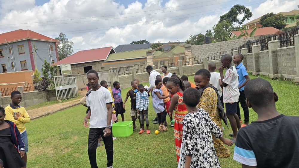 Children and leaders getting ready for a game outside at 5 Day Club