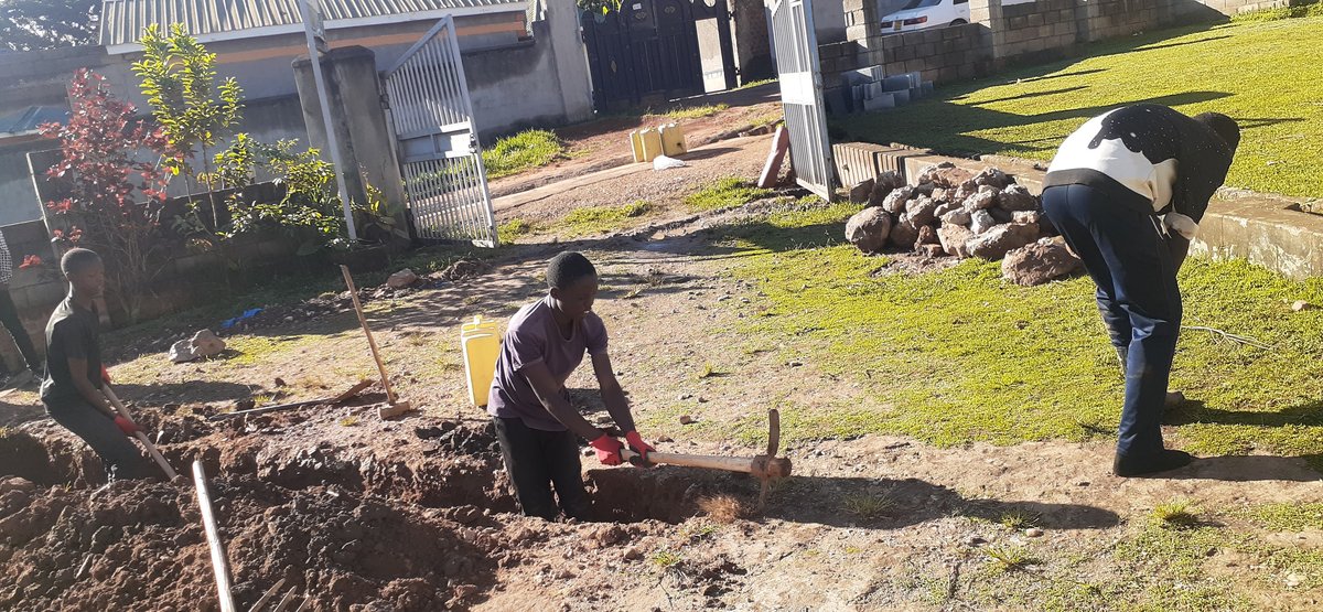 Church members preparing and improving the church grounds